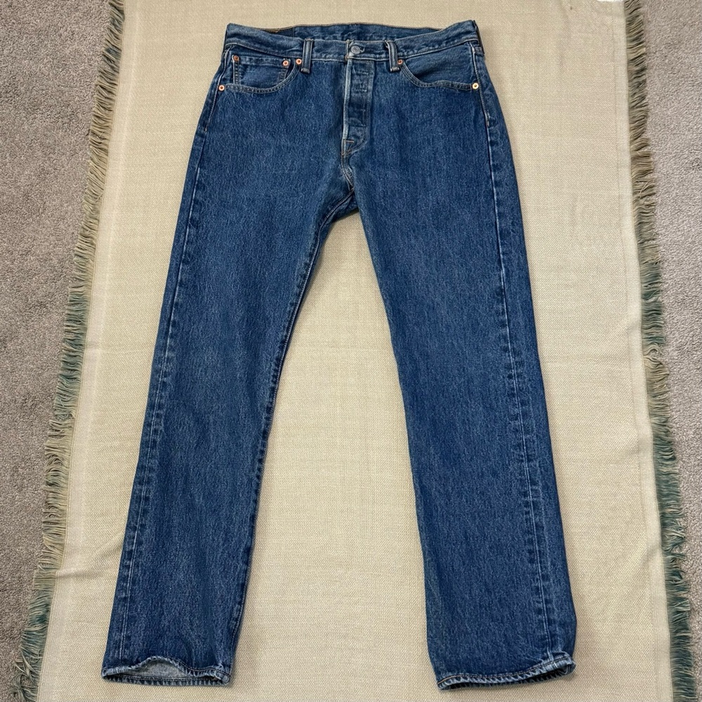 Levi's 501 Original Fit men's jeans, blue denim medium wash with a button fly.